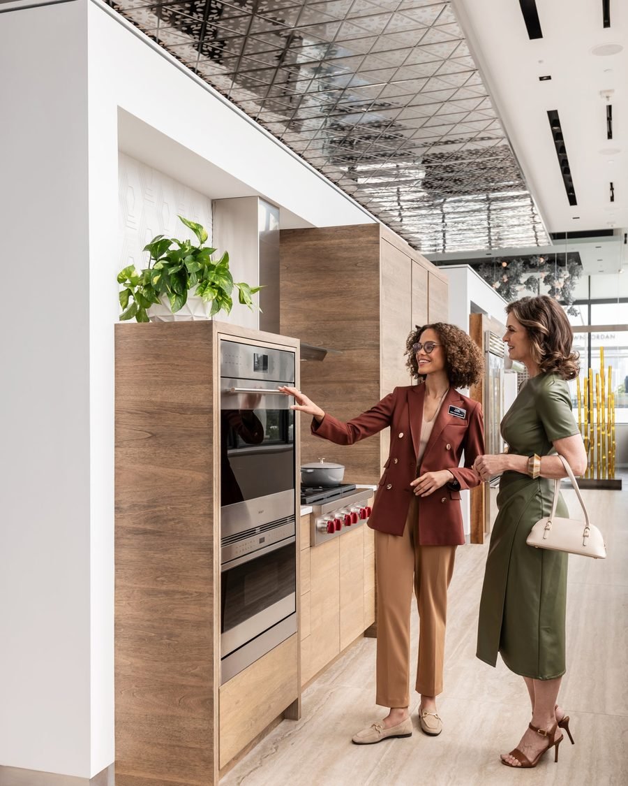 ArtTech technician discussing a built-in oven installation with a homeowner